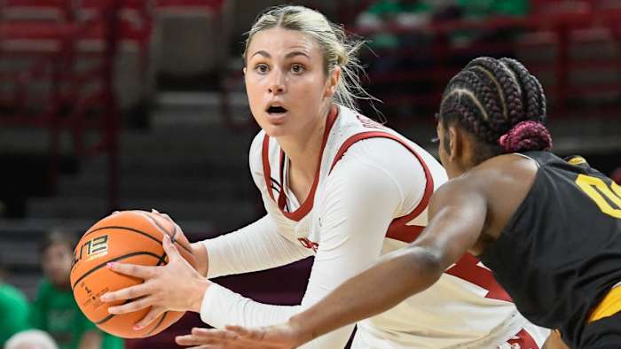 Razorbacks' Saylor Poffenbarger looks inside against UAPB on Sunday afternoon at Bud Walton Arena.